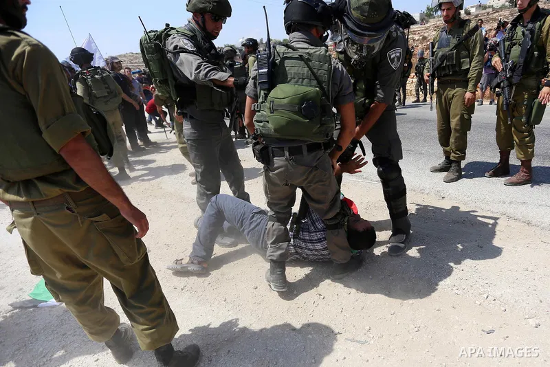 Israeli border policemen detain a Palestinian protester during a protest against Jewish settlements in the West Bank village of Nabi Saleh, near Ramallah September 4, 2015. Photo by Shadi Hatem