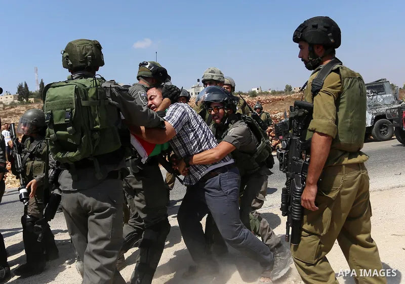 Israeli border policemen detain a Palestinian protester during a protest against Jewish settlements in the West Bank village of Nabi Saleh, near Ramallah September 4, 2015. Photo by Shadi Hatem