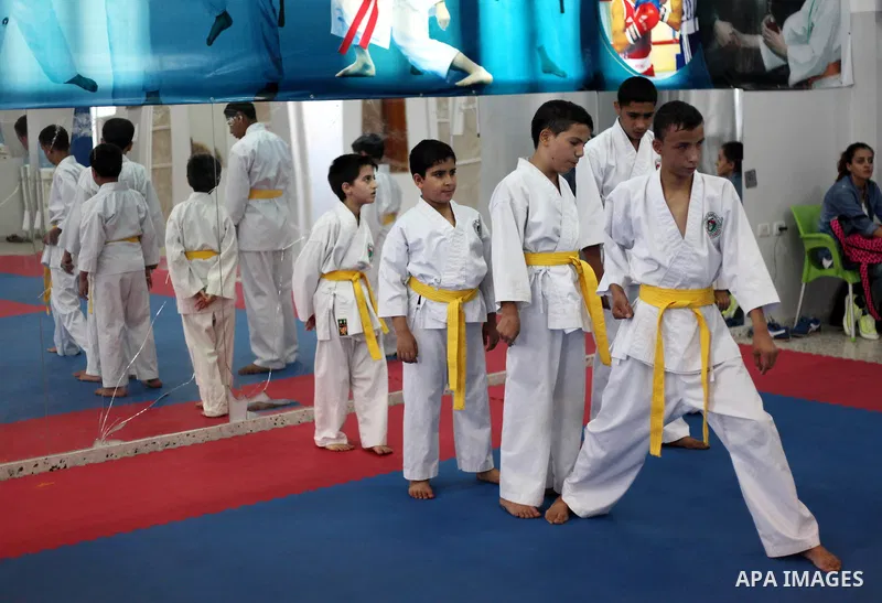 Blind and visually impaired Palestinian boys take part in a Karate class at al-Masthal club in Gaza city Sep. 06, 2015. The training is held twice a week by the club to lift the morale of the children, trainers said. Pho...