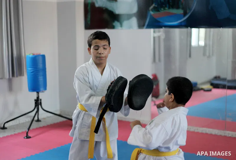 Blind and visually impaired Palestinian boys take part in a Karate class at al-Masthal club in Gaza city Sep. 06, 2015. The training is held twice a week by the club to lift the morale of the children, trainers said. Pho...