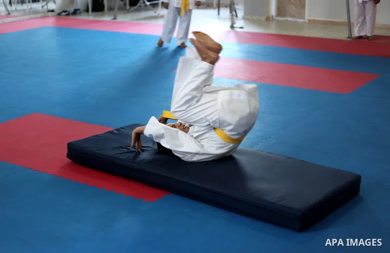 A visually impaired Palestinian boy take parts in a Karate class at al-Masthal club in Gaza city Sep. 06, 2015. The training is held twice a week by the club to lift the morale of the children, trainers said. Photo by As...