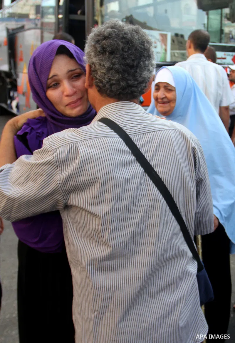 A Palestinian woman bids farewell to her father who leaves for the annual haj pilgrimage in Mecca, in Rafah the southern Gaza Strip September 7, 2015. Hundreds of Palestinian pilgrims are leaving Gaza through the Rafah b...