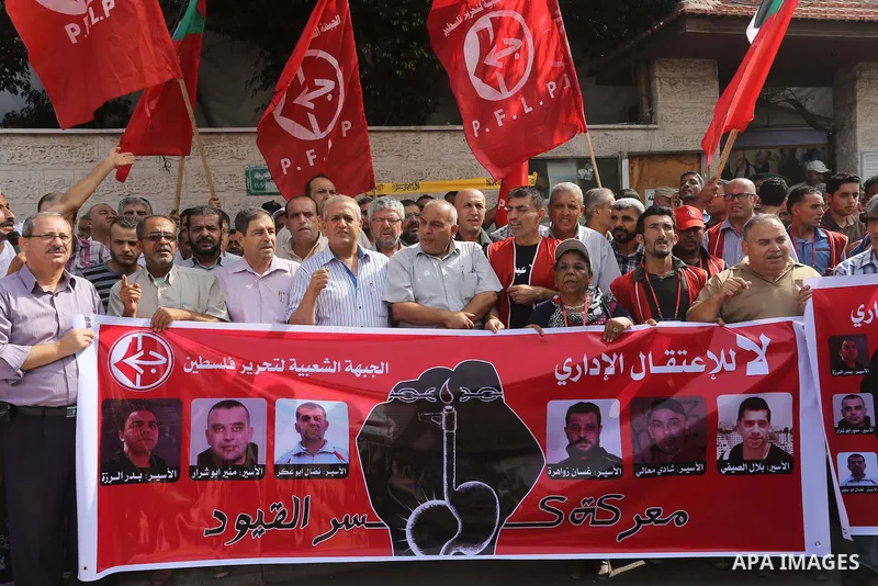 Palestinians take part in a protest demanding release the prisoners in Israeli jails, in front of Red cross office, in Gaza city, on Sep. 07, 2015. Photo by Mohammed Asad
