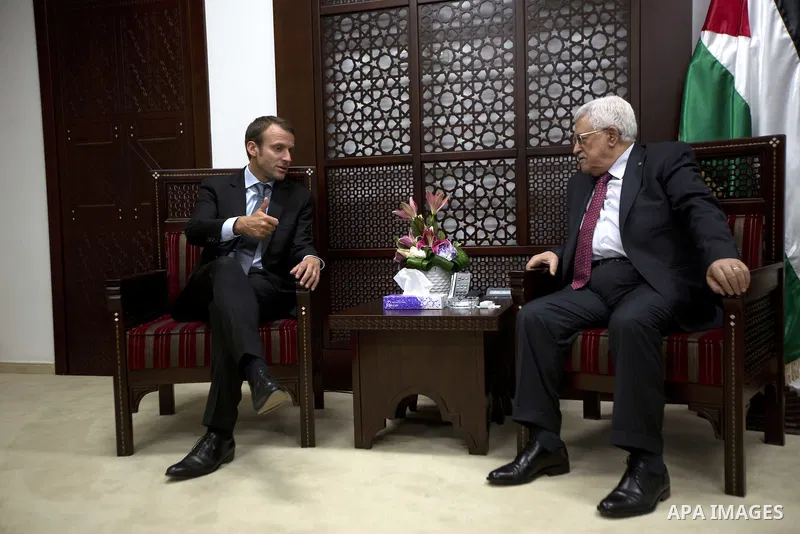Palestinian President Mahmoud Abbas meets with the French Economy Minister Emmanuel Macron, at his headquarter in the West Bank city of Ramallah, September 7, 2015. Photo by Shadi Hatem