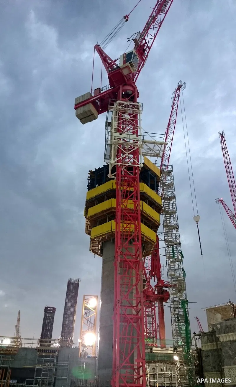 A construction crane used in the ongoing expansion is seen next to the Grand Mosque in the Muslim holy city of Mecca on September 10, 2015. According to the Muslims holy book the Koran, the Kaaba was built by Abraham and...