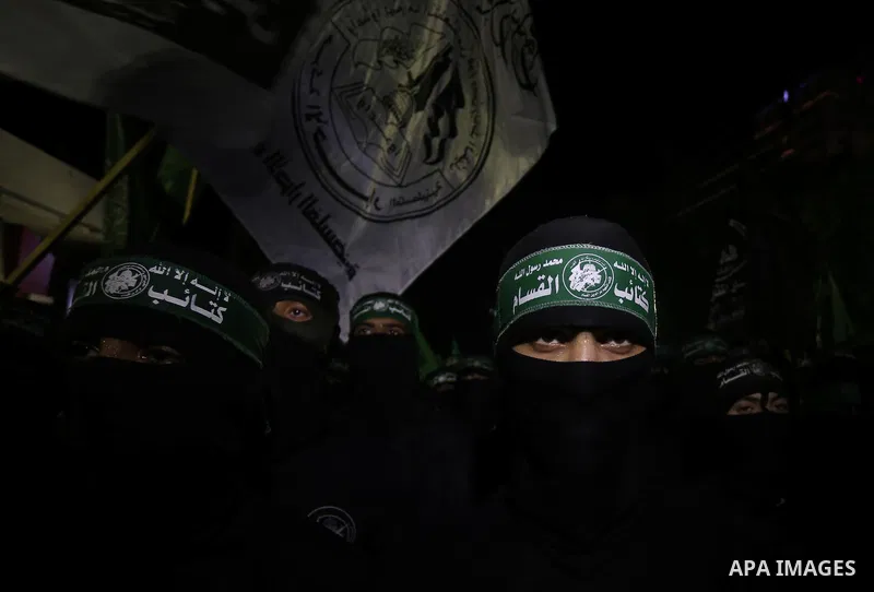 Palestinian supporters of Hamas movement take part in a protest against an Israeli police raid on Jerusalem's al-Aqsa mosque, and against the Palestinian President Mahmoud Abbas, in Gaza city on September 15, 2015. Photo...