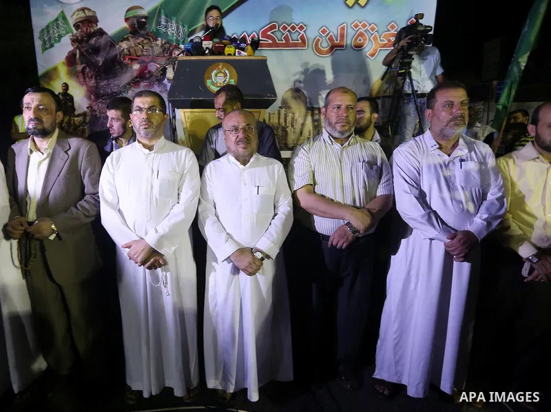 Palestinian supporters of Hamas movement take part in a protest against an Israeli police raid on Jerusalem's al-Aqsa mosque, and against the Palestinian President Mahmoud Abbas, in Gaza city on September 15, 2015. Photo...