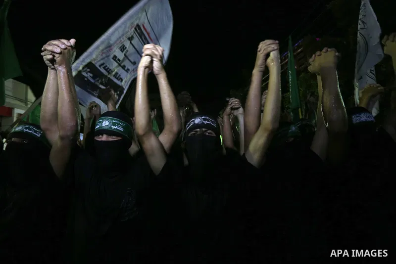 Palestinian supporters of Hamas movement take part in a protest against an Israeli police raid on Jerusalem's al-Aqsa mosque, and against the Palestinian President Mahmoud Abbas, in Gaza city on September 15, 2015. Photo...