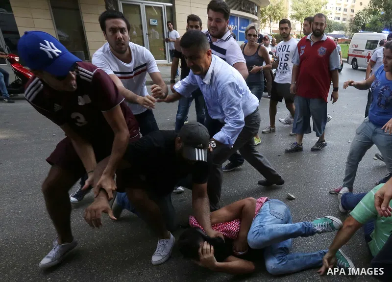 Lebanese activists from 'You Stink' campaign clash with riot police after a protest against today s session of a dialogue of top political figures, accused by the group of failing to resolve a crisis over rubbish buildin...