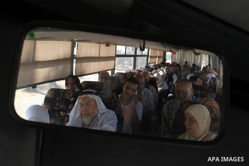 Families of Palestinian martyrs wait at the Rafah border crossing between Egypt and the southern Gaza Strip, on September 17, 2015, as they head to the annual hajj pilgrimage in Saudi Arabia's holy city of Mecca. Custodi...