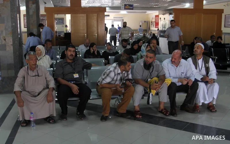 Families of Palestinian martyrs wait at the Rafah border crossing between Egypt and the southern Gaza Strip, on September 17, 2015, as they head to the annual hajj pilgrimage in Saudi Arabia's holy city of Mecca. Custodi...