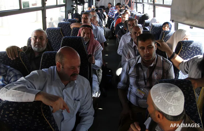 Families of Palestinian martyrs wait at the Rafah border crossing between Egypt and the southern Gaza Strip, on September 17, 2015, as they head to the annual hajj pilgrimage in Saudi Arabia's holy city of Mecca. Custodi...
