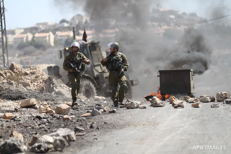 Israeli security forces run after Palestinian protesters during clashes following a demonstration in defence of the Al-Aqsa mosque, Islam s third holiest site, located in Jerusalem's old city, after the weekly Friday pra...