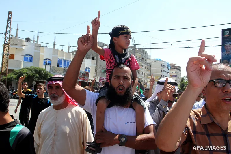 Palestinian Islamic Jihad supporters take part in a protest against the Israeli police raid on Jerusalem's al-Aqsa mosque on Tuesday, in Rafah in the southern Gaza Strip, September 18, 2015. Israel deployed hundreds of e...