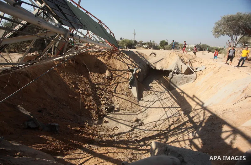 Palestinians look at the damage following an Israeli air strike overnight in the northern Gaza strip of Beit Hanun on September 19, 2015. Two rockets were fired into southern Israel by Palestinian militants in Gaza, caus...
