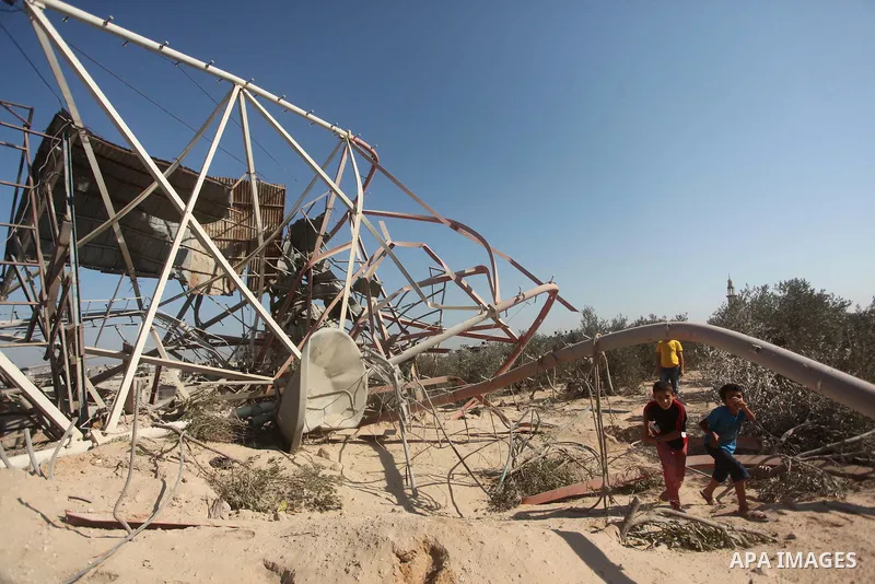 Palestinians look at the damage following an Israeli air strike overnight in the northern Gaza strip of Beit Hanun on September 19, 2015. Two rockets were fired into southern Israel by Palestinian militants in Gaza, caus...