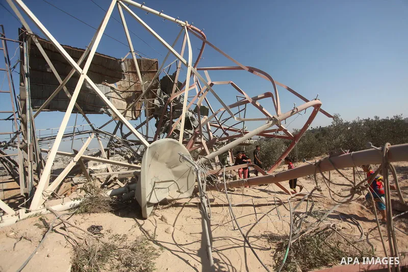 Palestinians look at the damage following an Israeli air strike overnight in the northern Gaza strip of Beit Hanun on September 19, 2015. Two rockets were fired into southern Israel by Palestinian militants in Gaza, caus...