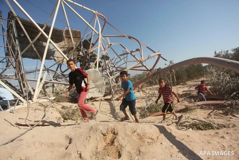Palestinians look at the damage following an Israeli air strike overnight in the northern Gaza strip of Beit Hanun on September 19, 2015. Two rockets were fired into southern Israel by Palestinian militants in Gaza, caus...