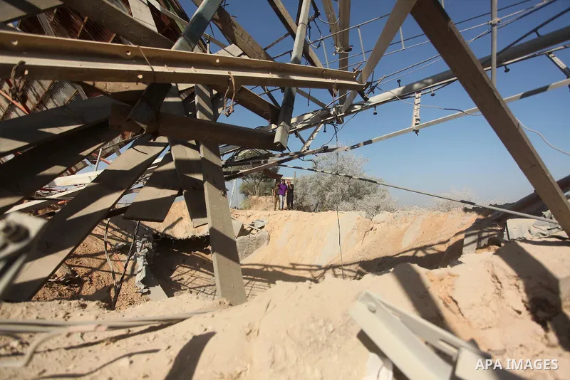 Palestinians look at the damage following an Israeli air strike overnight in the northern Gaza strip of Beit Hanun on September 19, 2015. Two rockets were fired into southern Israel by Palestinian militants in Gaza, caus...