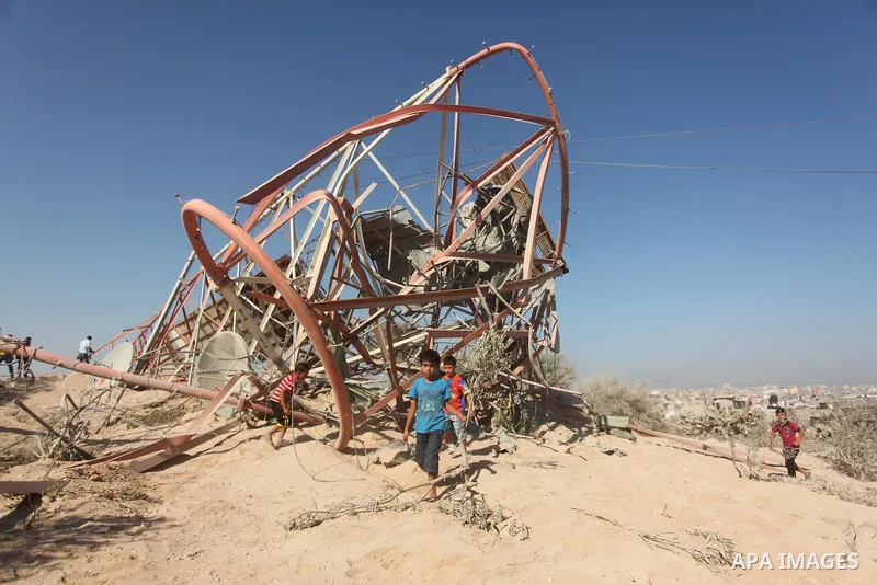 Palestinians look at the damage following an Israeli air strike overnight in the northern Gaza strip of Beit Hanun on September 19, 2015. Two rockets were fired into southern Israel by Palestinian militants in Gaza, caus...