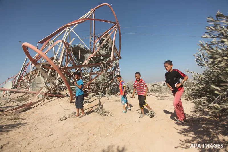 Palestinians look at the damage following an Israeli air strike overnight in the northern Gaza strip of Beit Hanun on September 19, 2015. Two rockets were fired into southern Israel by Palestinian militants in Gaza, caus...