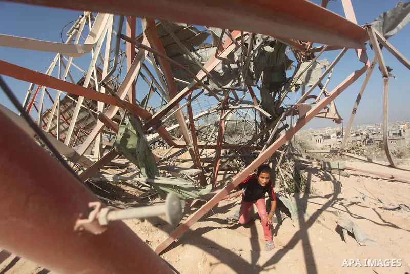 Palestinians look at the damage following an Israeli air strike overnight in the northern Gaza strip of Beit Hanun on September 19, 2015. Two rockets were fired into southern Israel by Palestinian militants in Gaza, caus...