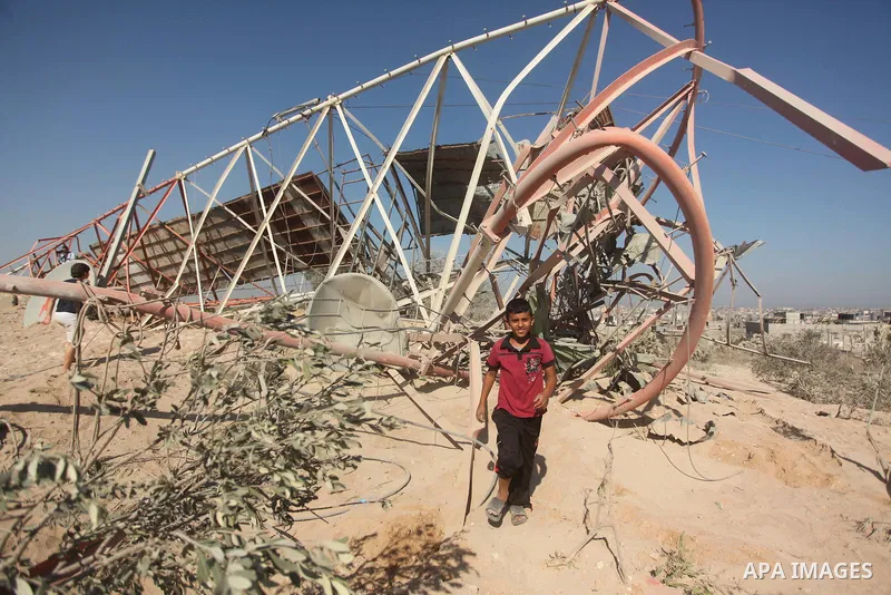 Palestinians look at the damage following an Israeli air strike overnight in the northern Gaza strip of Beit Hanun on September 19, 2015. Two rockets were fired into southern Israel by Palestinian militants in Gaza, caus...