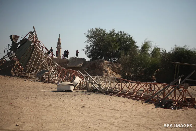 Palestinians look at the damage following an Israeli air strike overnight in the northern Gaza strip of Beit Hanun on September 19, 2015. Two rockets were fired into southern Israel by Palestinian militants in Gaza, caus...