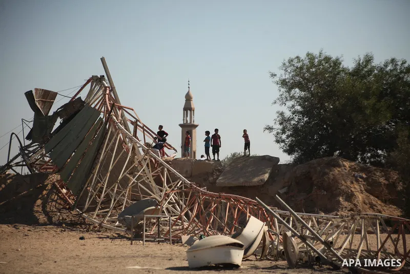 Palestinians look at the damage following an Israeli air strike overnight in the northern Gaza strip of Beit Hanun on September 19, 2015. Two rockets were fired into southern Israel by Palestinian militants in Gaza, caus...