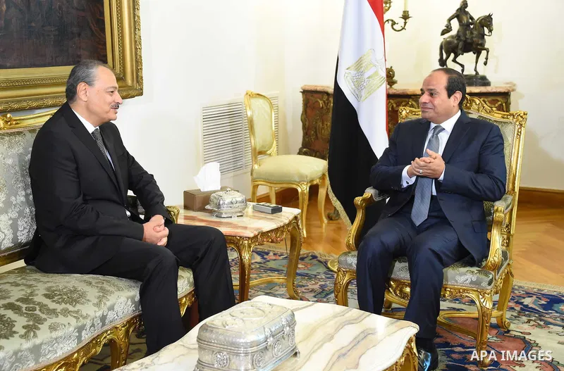 A handout picture made available by the Egyptian Presidency shows Egyptian President Abdel Fattah al-Sisi (R) meeting with Nabil Sadeq after he was sworn in as Egypt's new Attorney General on September 29, 2015. Sisi swo...