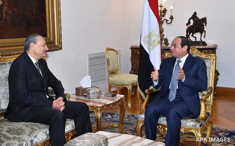 A handout picture made available by the Egyptian Presidency shows Egyptian President Abdel Fattah al-Sisi (R) meeting with Nabil Sadeq after he was sworn in as Egypt's new Attorney General on September 29, 2015. Sisi swo...