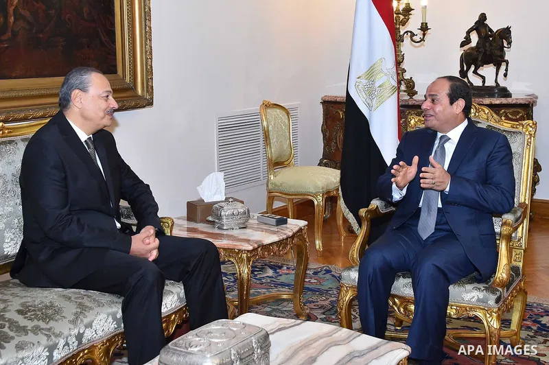 A handout picture made available by the Egyptian Presidency shows Egyptian President Abdel Fattah al-Sisi (R) meeting with Nabil Sadeq after he was sworn in as Egypt's new Attorney General on September 29, 2015. Sisi swo...
