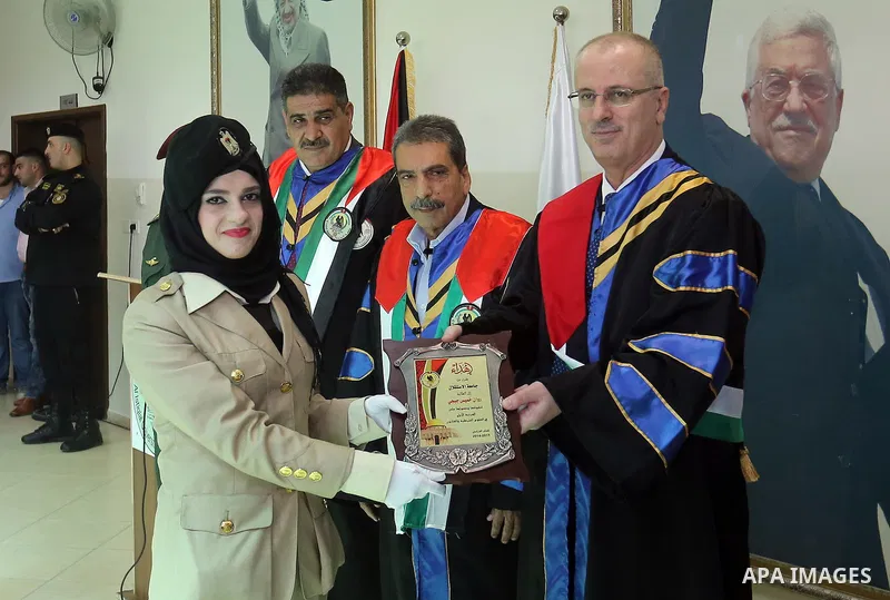 Palestinian Prime Minister, Rami Hamdallah, attends a graduation ceremony at Al-istiqlal University in the West bank city of Ramallah, on Sept. 19, 2015. Photo by Prime Minister Office