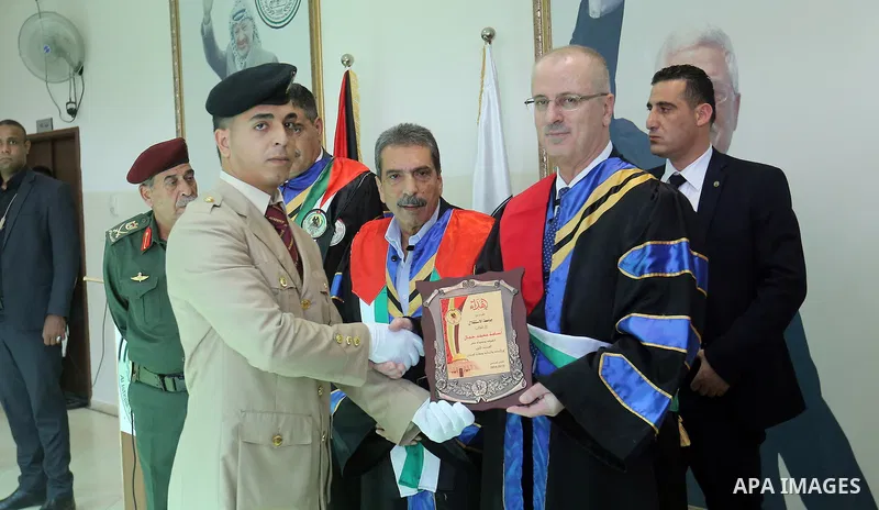 Palestinian Prime Minister, Rami Hamdallah, attends a graduation ceremony at Al-istiqlal University in the West bank city of Ramallah, on Sept. 19, 2015. Photo by Prime Minister Office