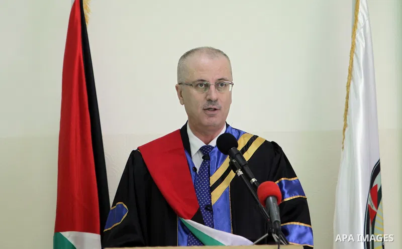 Palestinian Prime Minister, Rami Hamdallah, attends a graduation ceremony at Al-istiqlal University in the West bank city of Ramallah, on Sept. 19, 2015. Photo by Prime Minister Office