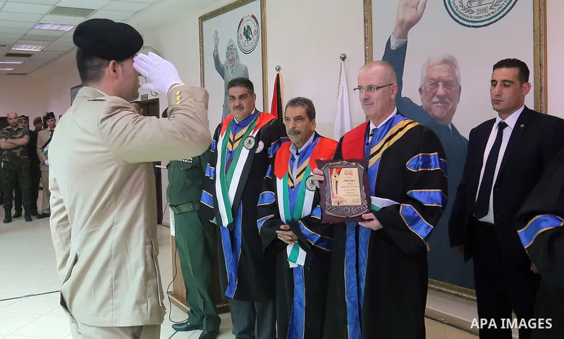 Palestinian Prime Minister, Rami Hamdallah, attends a graduation ceremony at Al-istiqlal University in the West bank city of Ramallah, on Sept. 19, 2015. Photo by Prime Minister Office