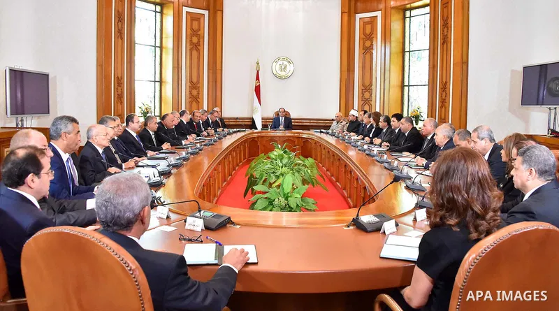 Egyptian President Abdel Fattah al-Sisi meets with the new cabinet ministers at the presidential palace in Cairo, Egypt, in this September 19, 2015 handout picture courtesy of the Egyptian Presidency. Al-Sisi kept his fi...