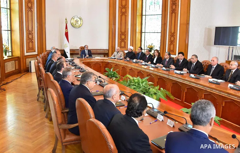 Egyptian President Abdel Fattah al-Sisi meets with the new cabinet ministers at the presidential palace in Cairo, Egypt, in this September 19, 2015 handout picture courtesy of the Egyptian Presidency. Al-Sisi kept his fi...