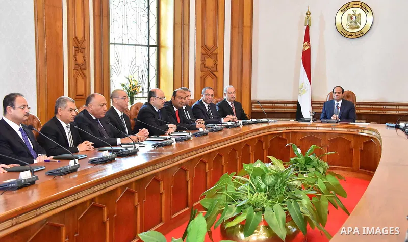 Egyptian President Abdel Fattah al-Sisi meets with the new cabinet ministers at the presidential palace in Cairo, Egypt, in this September 19, 2015 handout picture courtesy of the Egyptian Presidency. Al-Sisi kept his fi...