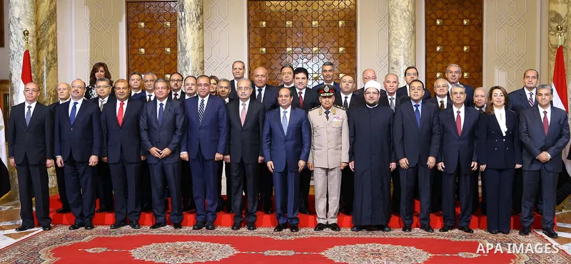 Egyptian President Abdel Fattah al-Sisi meets with the new cabinet ministers at the presidential palace in Cairo, Egypt, in this September 19, 2015 handout picture courtesy of the Egyptian Presidency. Al-Sisi kept his fi...