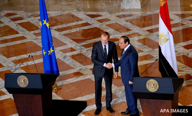 A handout picture made available by the Egyptian Presidency on September 19, 2015, shows Egyptian President Abdel Fattah al-Sisi shakes hand with EU President Donald Tusk during a joint press conference in the capital Ca...
