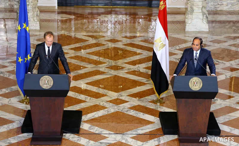 A handout picture made available by the Egyptian Presidency on September 19, 2015, shows Egyptian President Abdel Fattah al-Sisi listens to EU President Donald Tusk speak during a joint press conference in the capital Ca...