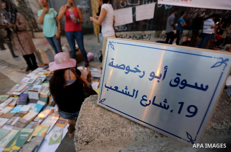 Lebanese participate in a popular market "Abu Rakhosa market" during the campaign "we want to accountable" against the head of the Beirut Traders Association Nicolas Shammas, in Riad al-Solh square in front of the Grand...