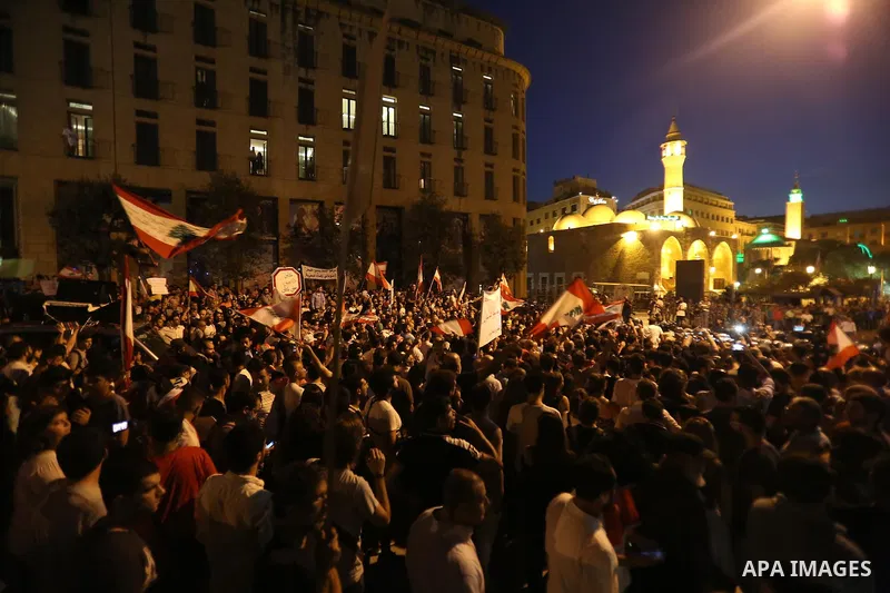 Protesters chant slogans and raise Lebanese national flags during a protest against perceived government failures, including a rubbish disposal crisis, in downtown Beirut, Lebanon September 20, 2015. Photo by Marwan Taht...