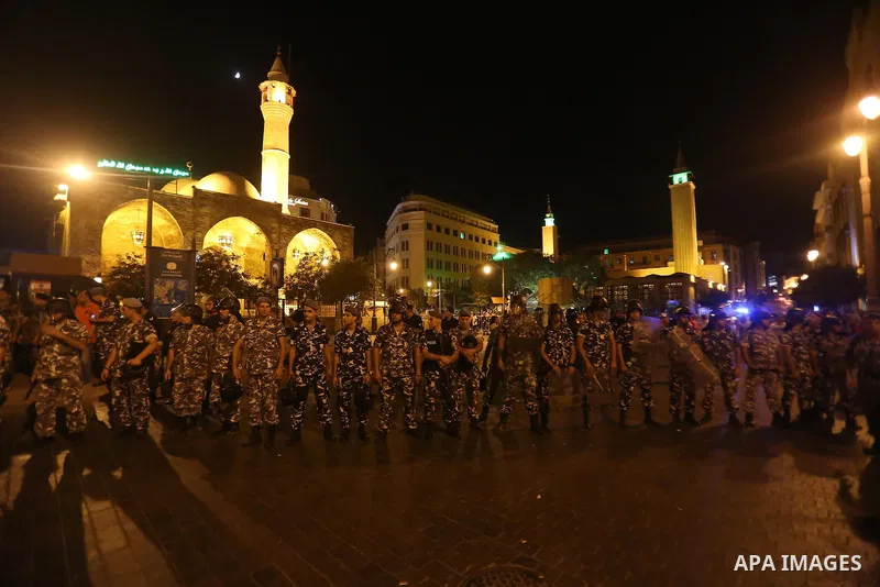 Protesters chant slogans and raise Lebanese national flags during a protest against perceived government failures, including a rubbish disposal crisis, in downtown Beirut, Lebanon September 20, 2015. Photo by Marwan Taht...