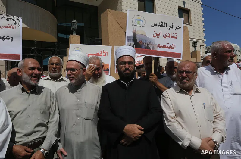 Members of the Palestine Scholars Association take part in a protest against the Israeli police raid on Jerusalem's al-Aqsa mosque on Tuesday, in Gaza city, September 21, 2015. Israel deployed hundreds of extra police ar...