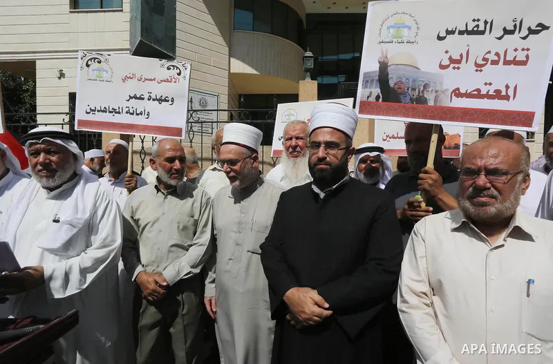Members of the Palestine Scholars Association take part in a protest against the Israeli police raid on Jerusalem's al-Aqsa mosque on Tuesday, in Gaza city, September 21, 2015. Israel deployed hundreds of extra police ar...