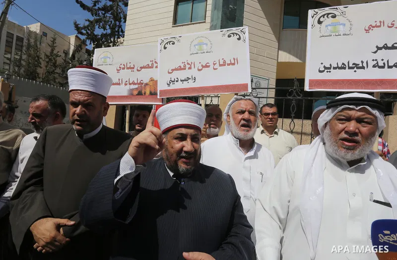 Members of the Palestine Scholars Association take part in a protest against the Israeli police raid on Jerusalem's al-Aqsa mosque on Tuesday, in Gaza city, September 21, 2015. Israel deployed hundreds of extra police ar...