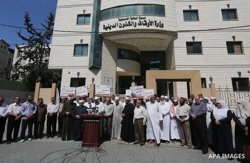 Members of the Palestine Scholars Association take part in a protest against the Israeli police raid on Jerusalem's al-Aqsa mosque on Tuesday, in Gaza city, September 21, 2015. Israel deployed hundreds of extra police ar...