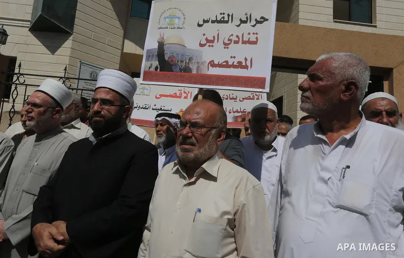 Members of the Palestine Scholars Association take part in a protest against the Israeli police raid on Jerusalem's al-Aqsa mosque on Tuesday, in Gaza city, September 21, 2015. Israel deployed hundreds of extra police ar...